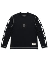 A black long-sleeve crewneck shirt by Converse, featuring white contrast stitching, white graphic lettering down both sleeves, brand emblem 'C' logo on the chest, and a small white brand label near the bottom hem.