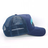 Side detail of the navy blue trucker cap displaying a different view of the hat style.